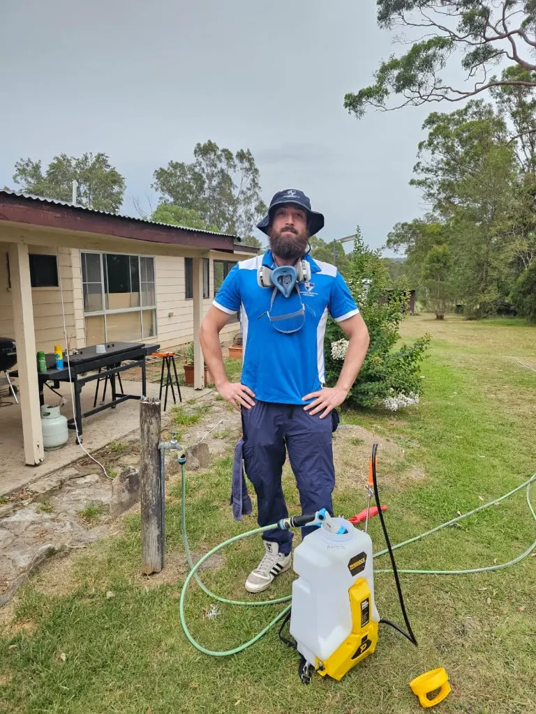 Sydney Pesties technician with a backpack sprayer for stink bug control